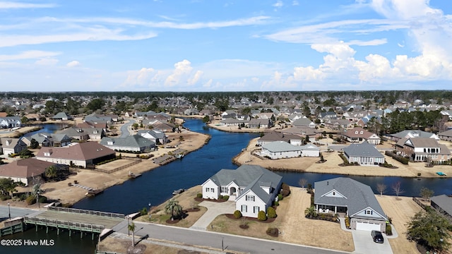 birds eye view of property with a residential view and a water view