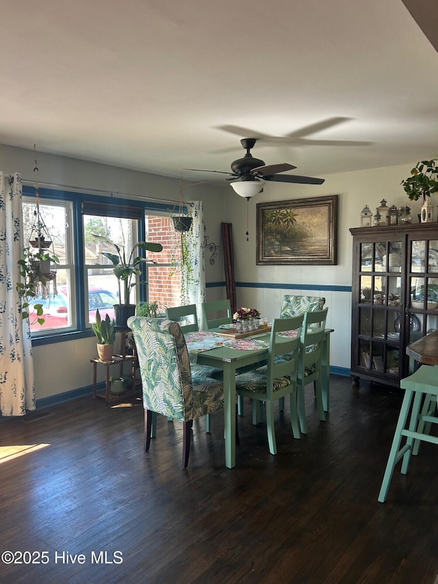 dining area with dark wood-type flooring