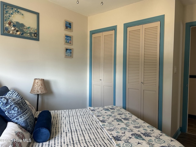 bedroom with multiple closets