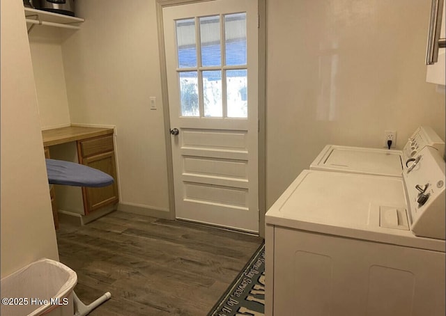 laundry area featuring dark wood-style floors, baseboards, laundry area, and washer and dryer