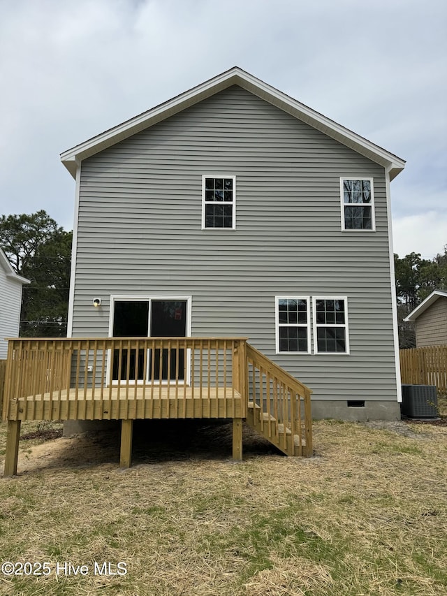 rear view of house with a deck, central AC unit, and crawl space