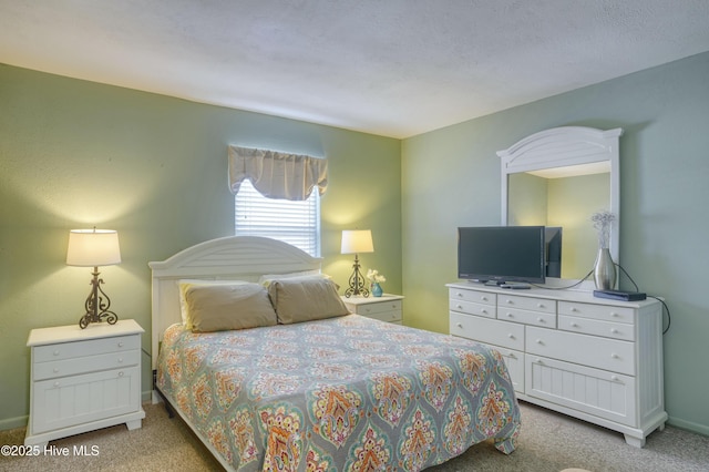 918 N New River Dr Unit 728, Surf City, NC 28445 - carpeted bedroom featuring baseboards
