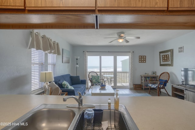 918 N New River Dr Unit 728, Surf City, NC 28445 - kitchen featuring open floor plan, light countertops, ceiling fan, a sink, and wood finished floors