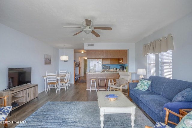 918 N New River Dr Unit 728, Surf City, NC 28445 - living room with visible vents, ceiling fan, and dark wood-style floors