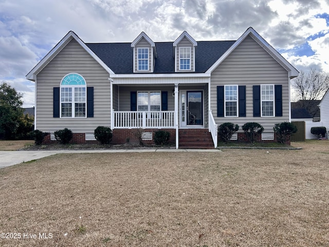 view of front of property featuring roof with shingles, a porch, crawl space, and a front yard