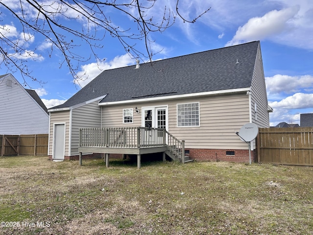 back of house with a deck, a fenced backyard, a yard, roof with shingles, and crawl space