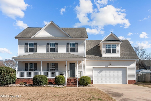 view of front of home featuring a shingled roof, covered porch, concrete driveway, an attached garage, and fence