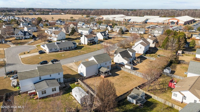 birds eye view of property with a residential view