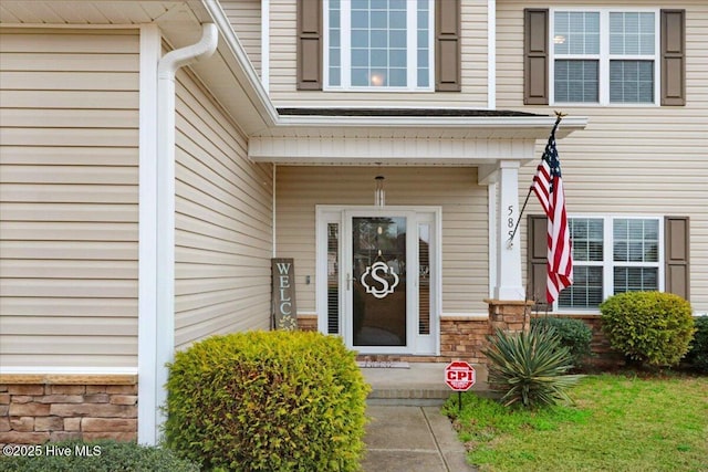 view of exterior entry with stone siding