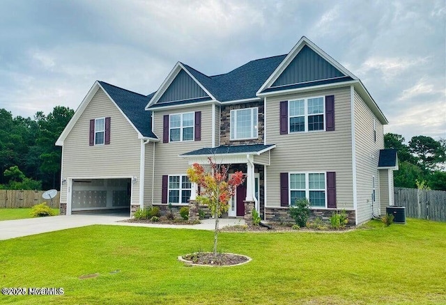 craftsman-style home with a garage, stone siding, and board and batten siding