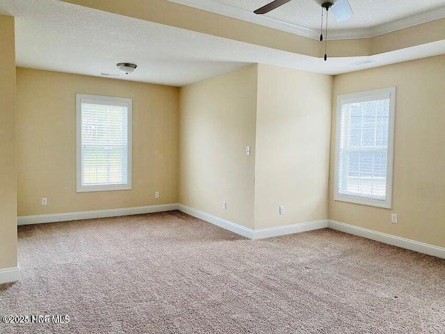 unfurnished room featuring carpet floors, baseboards, and a textured ceiling