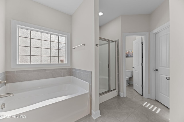 full bathroom with a stall shower, tile patterned flooring, a garden tub, and toilet