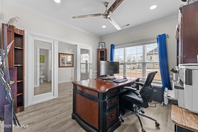 office with visible vents, crown molding, light wood finished floors, and ceiling fan