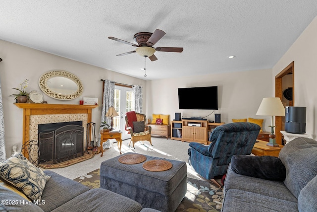 122 Charlie Lewis Ln, Beaufort, NC 28516 - living room featuring a ceiling fan, carpet flooring, a fireplace, and a textured ceiling