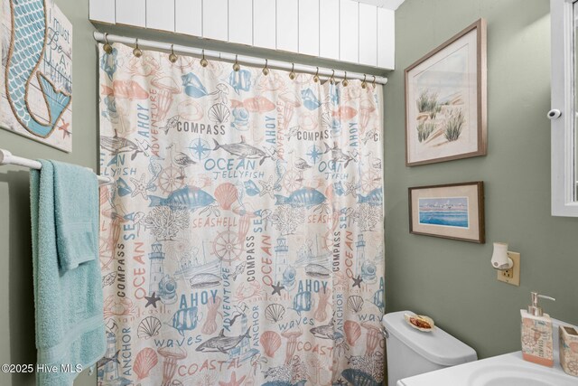122 Charlie Lewis Ln, Beaufort, NC 28516 - bathroom featuring toilet and a shower with shower curtain