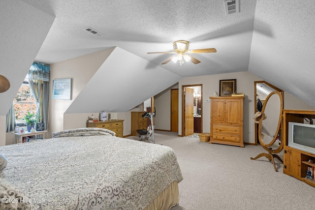 122 Charlie Lewis Ln, Beaufort, NC 28516 - bedroom featuring light colored carpet, a textured ceiling, vaulted ceiling, and a ceiling fan