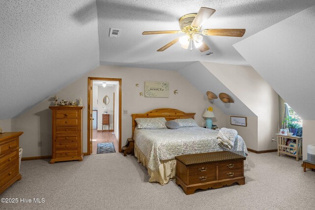 122 Charlie Lewis Ln, Beaufort, NC 28516 - bedroom featuring light colored carpet, vaulted ceiling, a textured ceiling, baseboards, and a ceiling fan