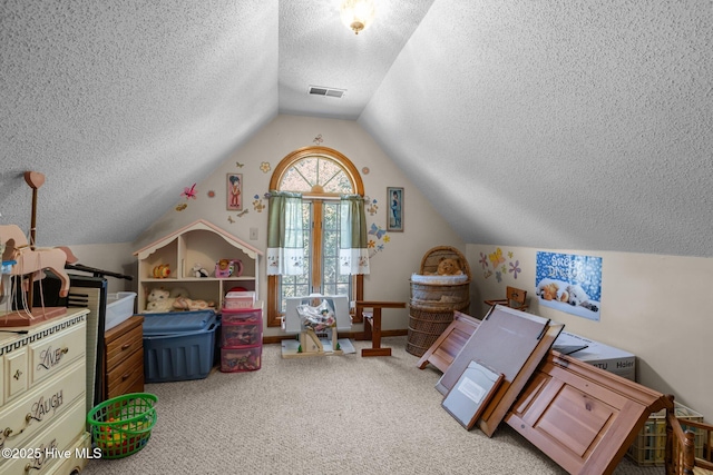 122 Charlie Lewis Ln, Beaufort, NC 28516 - bedroom featuring a textured ceiling, lofted ceiling, and carpet flooring