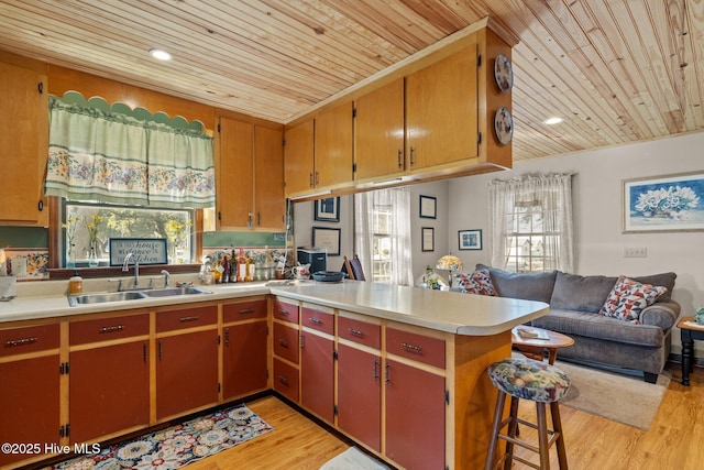 122 Charlie Lewis Ln, Beaufort, NC 28516 - kitchen featuring a sink, wooden ceiling, open floor plan, healthy amount of natural light, and a peninsula