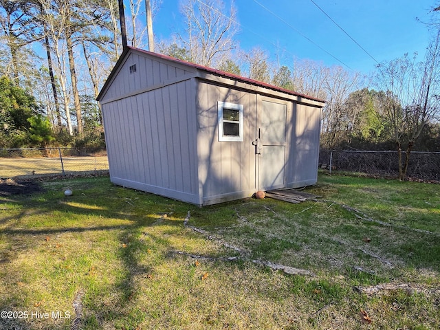 view of shed featuring a fenced backyard