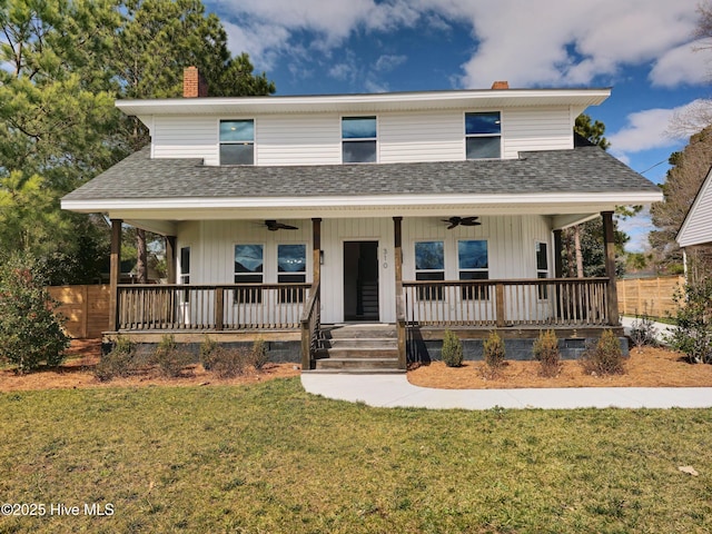 view of front of home with a ceiling fan, a front yard, covered porch, and a chimney