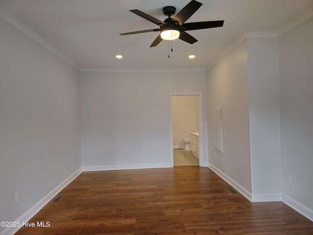 empty room with crown molding, recessed lighting, wood finished floors, and baseboards