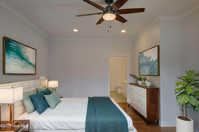 bedroom featuring recessed lighting, ornamental molding, ensuite bathroom, and wood finished floors