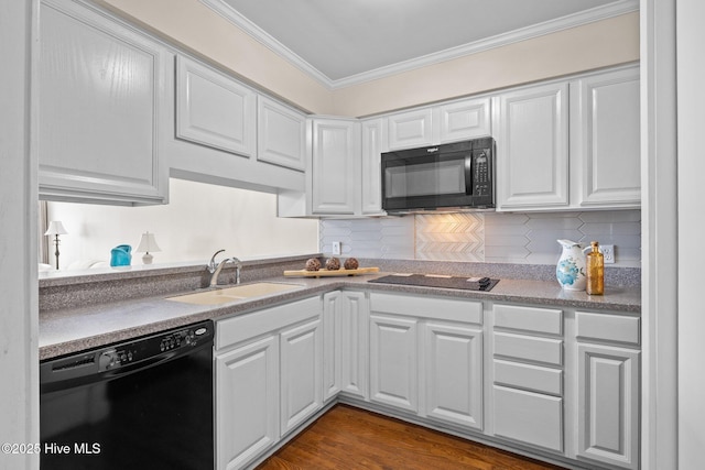 kitchen with black appliances, a sink, white cabinetry, and crown molding