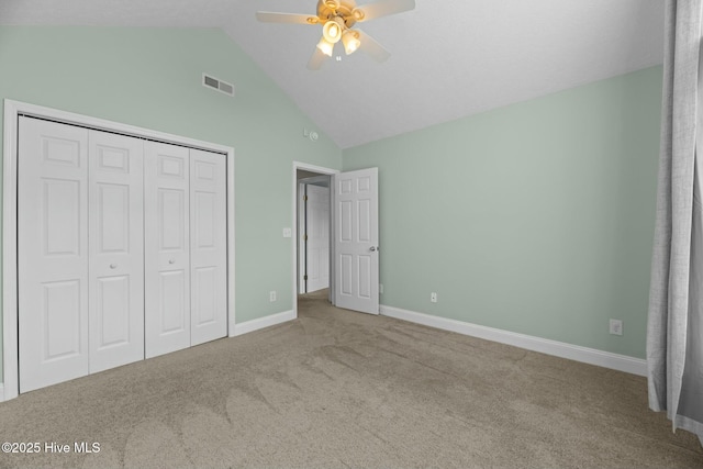 unfurnished bedroom with carpet floors, a ceiling fan, visible vents, baseboards, and a closet