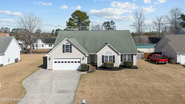 view of front of home featuring roof with shingles, concrete driveway, fence, a garage, and a front lawn