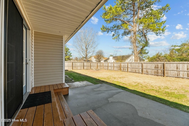 view of yard featuring a patio area and a fenced backyard