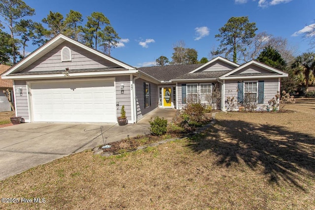 ranch-style home featuring a front yard, driveway, and an attached garage