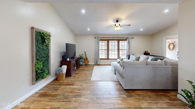 living room featuring recessed lighting, vaulted ceiling, ceiling fan, wood finished floors, and baseboards