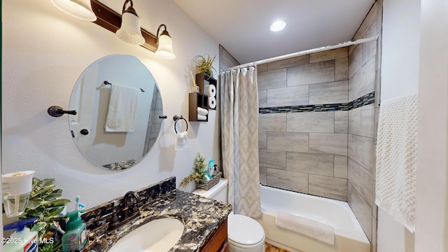 full bathroom featuring toilet, shower / bath combination with curtain, and vanity