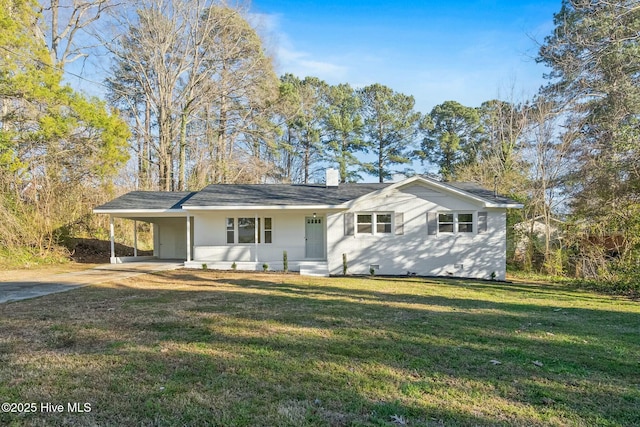 ranch-style house featuring a carport, concrete driveway, a chimney, and a front yard