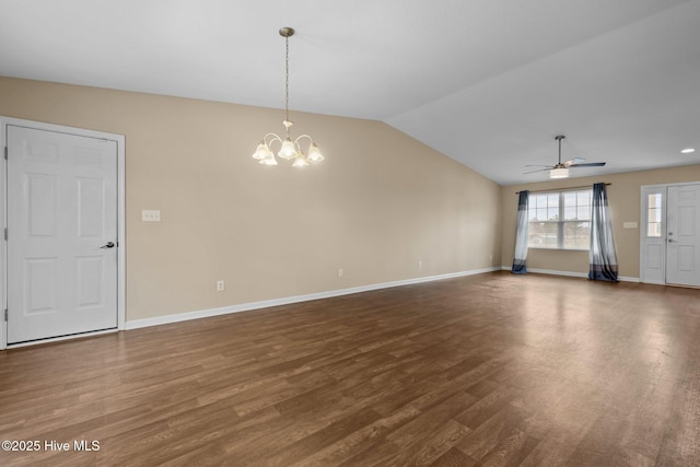 unfurnished living room with baseboards, wood finished floors, and vaulted ceiling