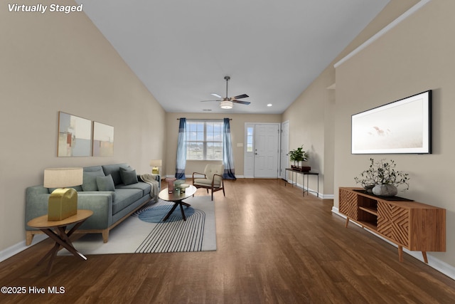 living room with a ceiling fan, wood finished floors, baseboards, and high vaulted ceiling