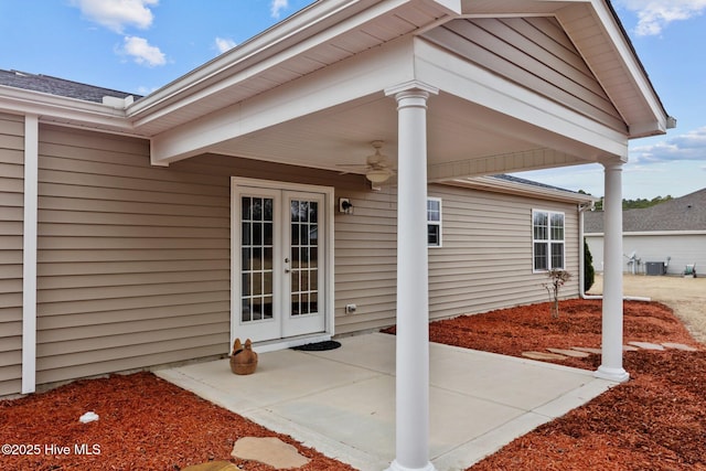 view of patio / terrace with a ceiling fan, french doors, and central AC