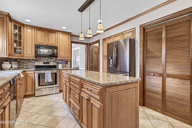 kitchen featuring light tile patterned floors, appliances with stainless steel finishes, backsplash, and ornamental molding