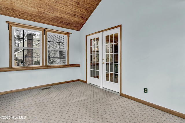 unfurnished room featuring french doors, lofted ceiling, visible vents, wood ceiling, and baseboards