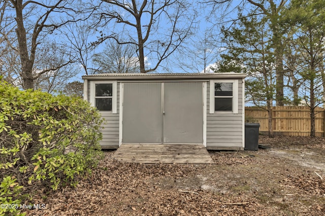 view of shed with fence