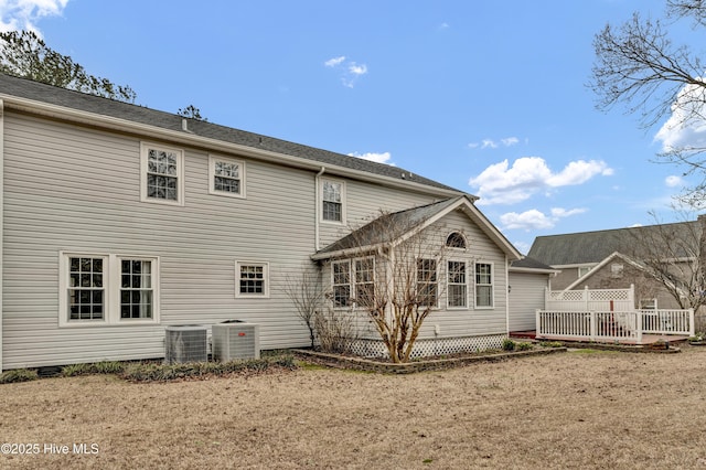 back of property featuring crawl space and central air condition unit