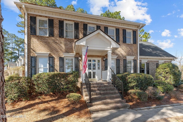 view of front facade featuring brick siding