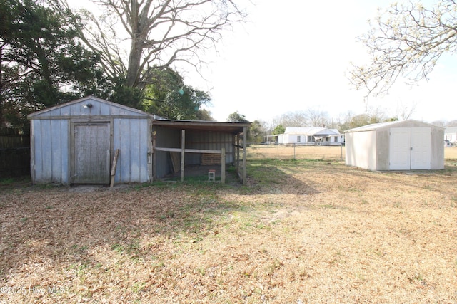 view of shed with fence