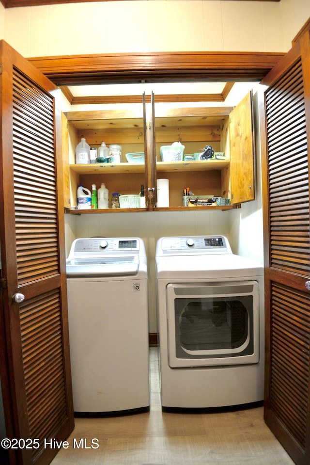 laundry room with laundry area and washing machine and clothes dryer