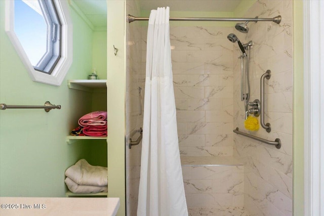 bathroom featuring a shower stall