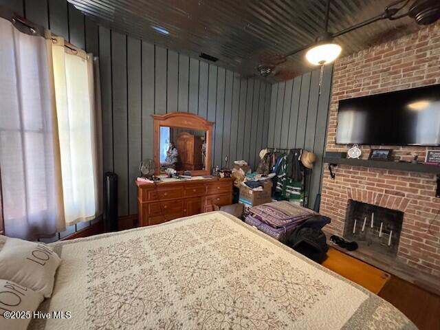 bedroom with a brick fireplace