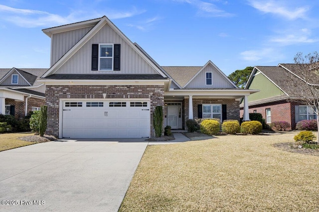 craftsman-style house featuring brick siding, board and batten siding, driveway, and a front yard