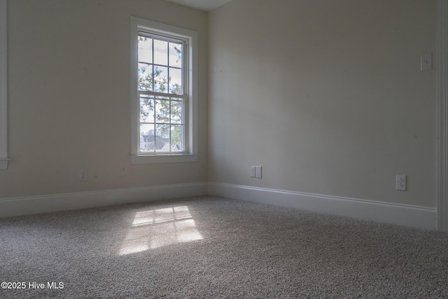 empty room with baseboards