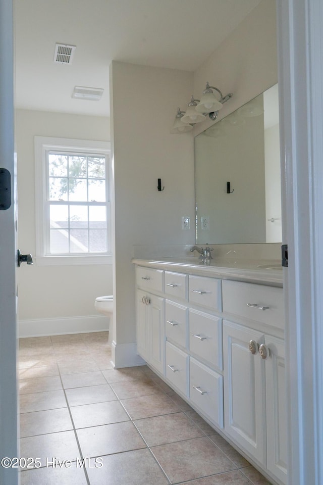 111 Wingate Dr, New Bern, NC 28562 - bathroom with toilet, vanity, visible vents, tile patterned floors, and baseboards